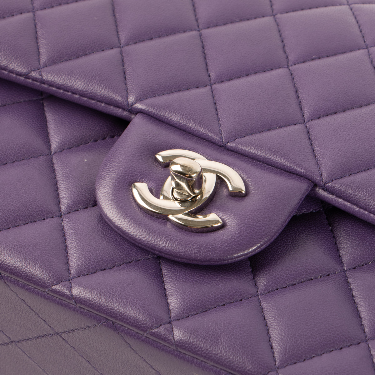Shop this authentic luxury Chanel Purple Lambskin Medium Classic 11.12 Handbag Pre-Loved on Labellov.com