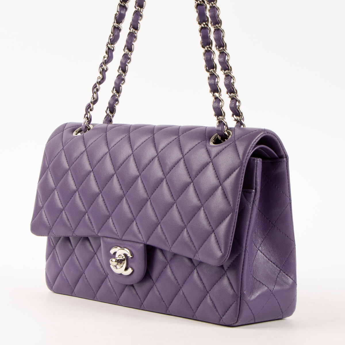 Shop this authentic luxury Chanel Purple Lambskin Medium Classic 11.12 Handbag Pre-Loved on Labellov.com