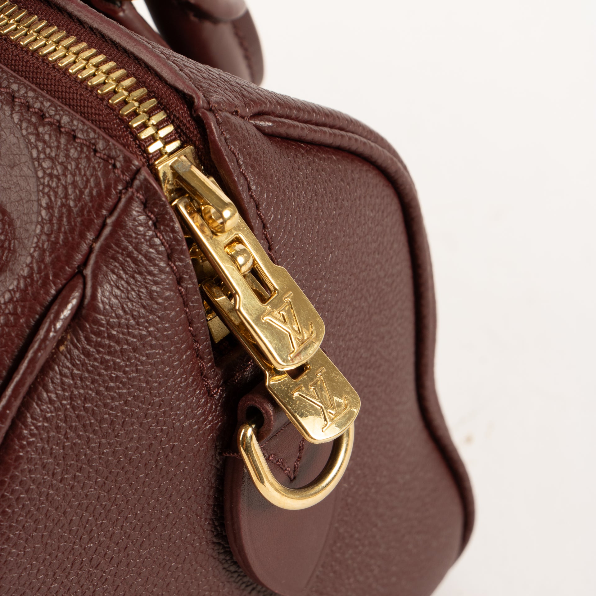 Shop the authentic Louis Vuitton Grenat Monogram Empreinte Speedy Bandoulière 20 Bag on Labellov.com !