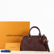 Shop the authentic Louis Vuitton Grenat Monogram Empreinte Speedy Bandoulière 20 Bag on Labellov.com !