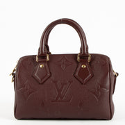 Shop the authentic Louis Vuitton Grenat Monogram Empreinte Speedy Bandoulière 20 Bag on Labellov.com !