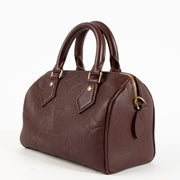 Shop the authentic Louis Vuitton Grenat Monogram Empreinte Speedy Bandoulière 20 Bag on Labellov.com !