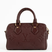 Shop the authentic Louis Vuitton Grenat Monogram Empreinte Speedy Bandoulière 20 Bag on Labellov.com !