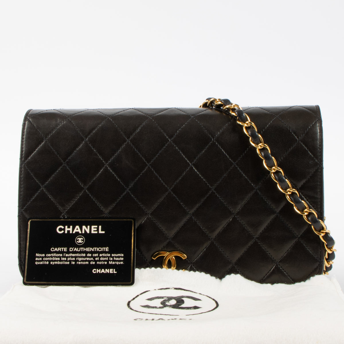 Shop this luxury authentic Chanel Vintage Black Lambskin Small Full Flap Bag Pre-Loved on Labellov.com