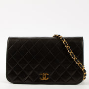 Shop this luxury authentic Chanel Vintage Black Lambskin Small Full Flap Bag Pre-Loved on Labellov.com