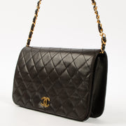 Shop this luxury authentic Chanel Vintage Black Lambskin Small Full Flap Bag Pre-Loved on Labellov.com