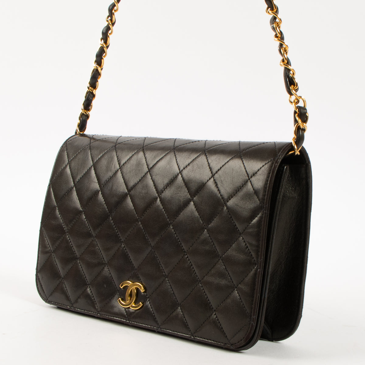 Shop this luxury authentic Chanel Vintage Black Lambskin Small Full Flap Bag Pre-Loved on Labellov.com