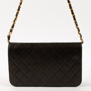 Shop this luxury authentic Chanel Vintage Black Lambskin Small Full Flap Bag Pre-Loved on Labellov.com