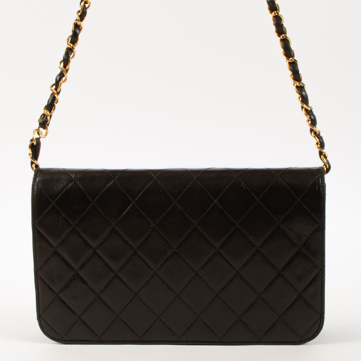 Shop this luxury authentic Chanel Vintage Black Lambskin Small Full Flap Bag Pre-Loved on Labellov.com