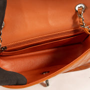 Shop this authentic Chanel Burnt Orange Patent Leather Mini Classic Bag pre-loved on Labellov.com