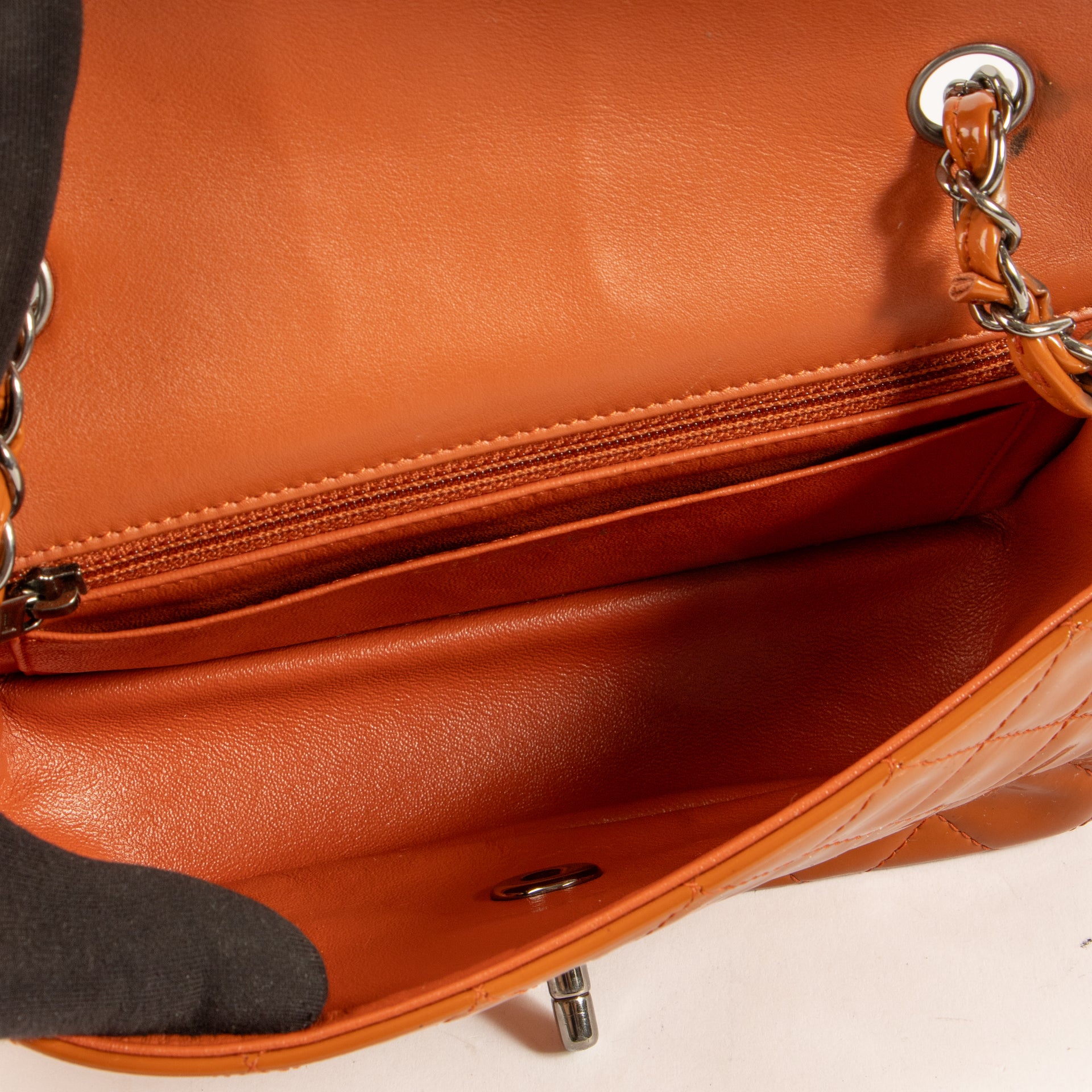 Shop this authentic Chanel Burnt Orange Patent Leather Mini Classic Bag pre-loved on Labellov.com