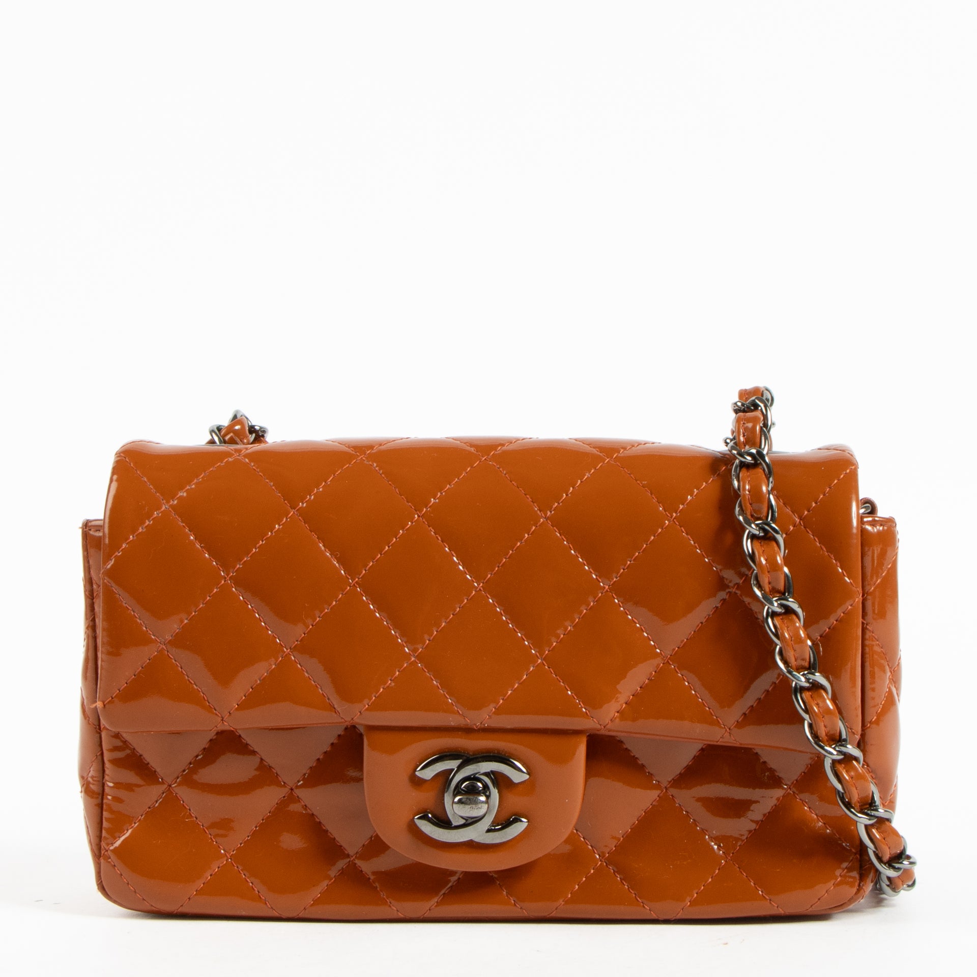 Shop this authentic Chanel Burnt Orange Patent Leather Mini Classic Bag pre-loved on Labellov.com