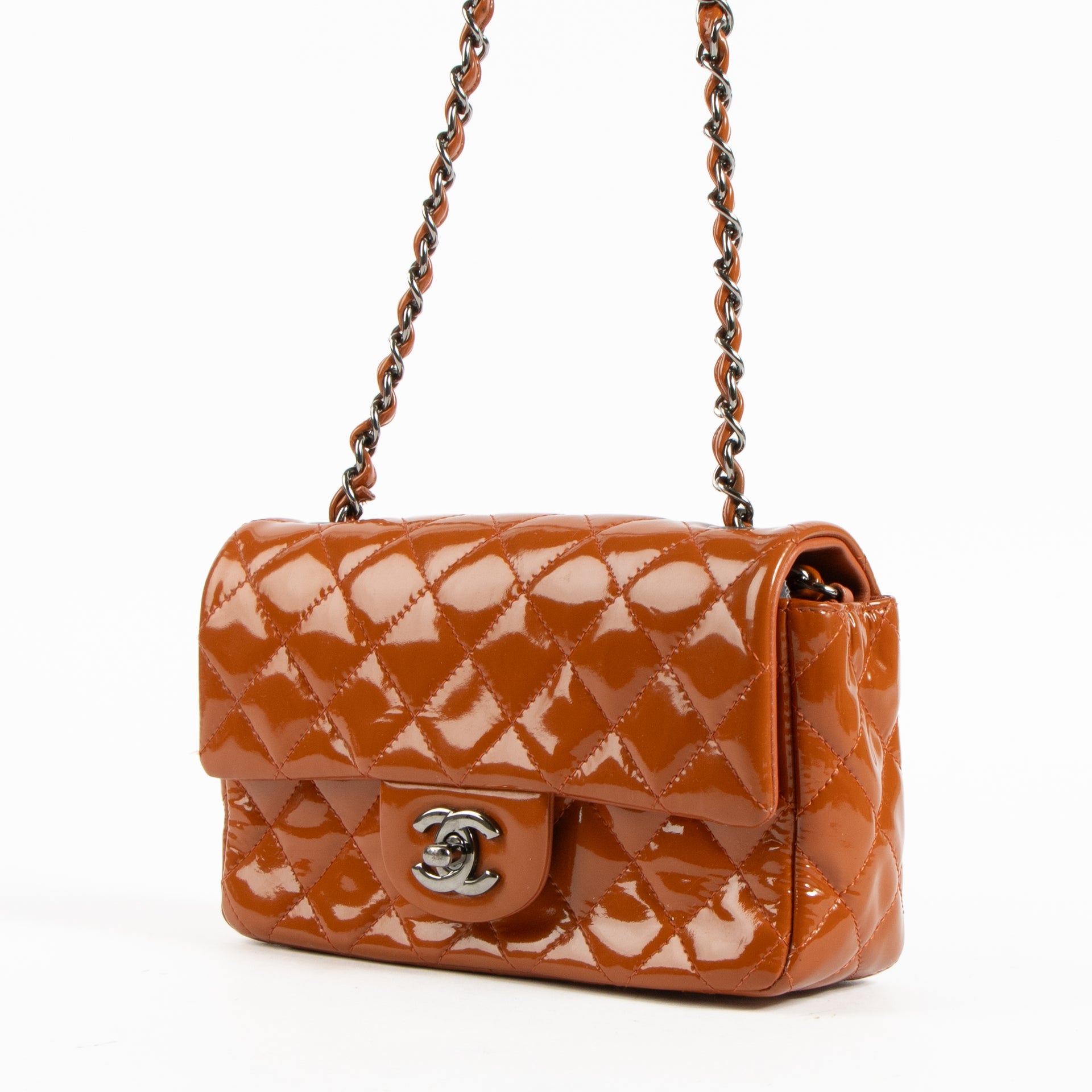 Shop this authentic Chanel Burnt Orange Patent Leather Mini Classic Bag pre-loved on Labellov.com