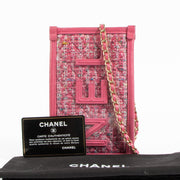 Shop authentic Chanel Pink Tweed PVC Phone Pouch with Chain on Labellov.com.
