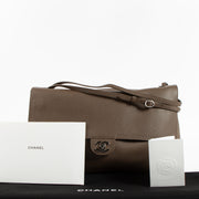 Shop the authentic Chanel Light Brown Grained Calfskin Maxi Flap Bag on Labellov.com !