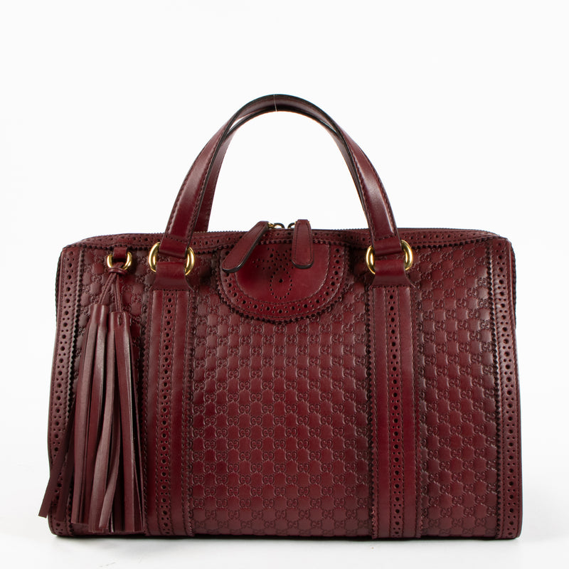 Shop this authentic Gucci Red Guilio Brogue Top handle pre-loved on Labellov.com 