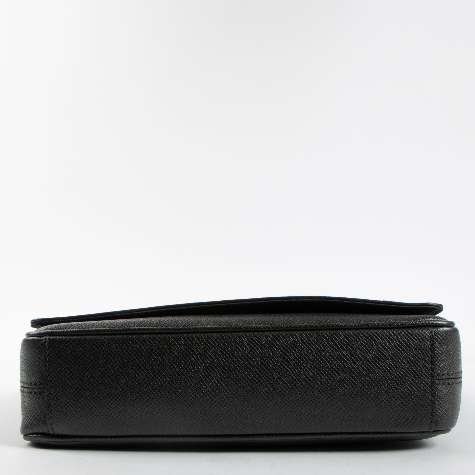 Shop the authentic Louis Vuitton Black Taiga District PM Messenger Bag second hand on Labellov.com!