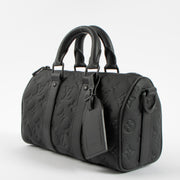 Shop this authentic Louis Vuitton Black Monogram Empreinte Keepall Bandouliere 20 pre-loved on Labellov.com