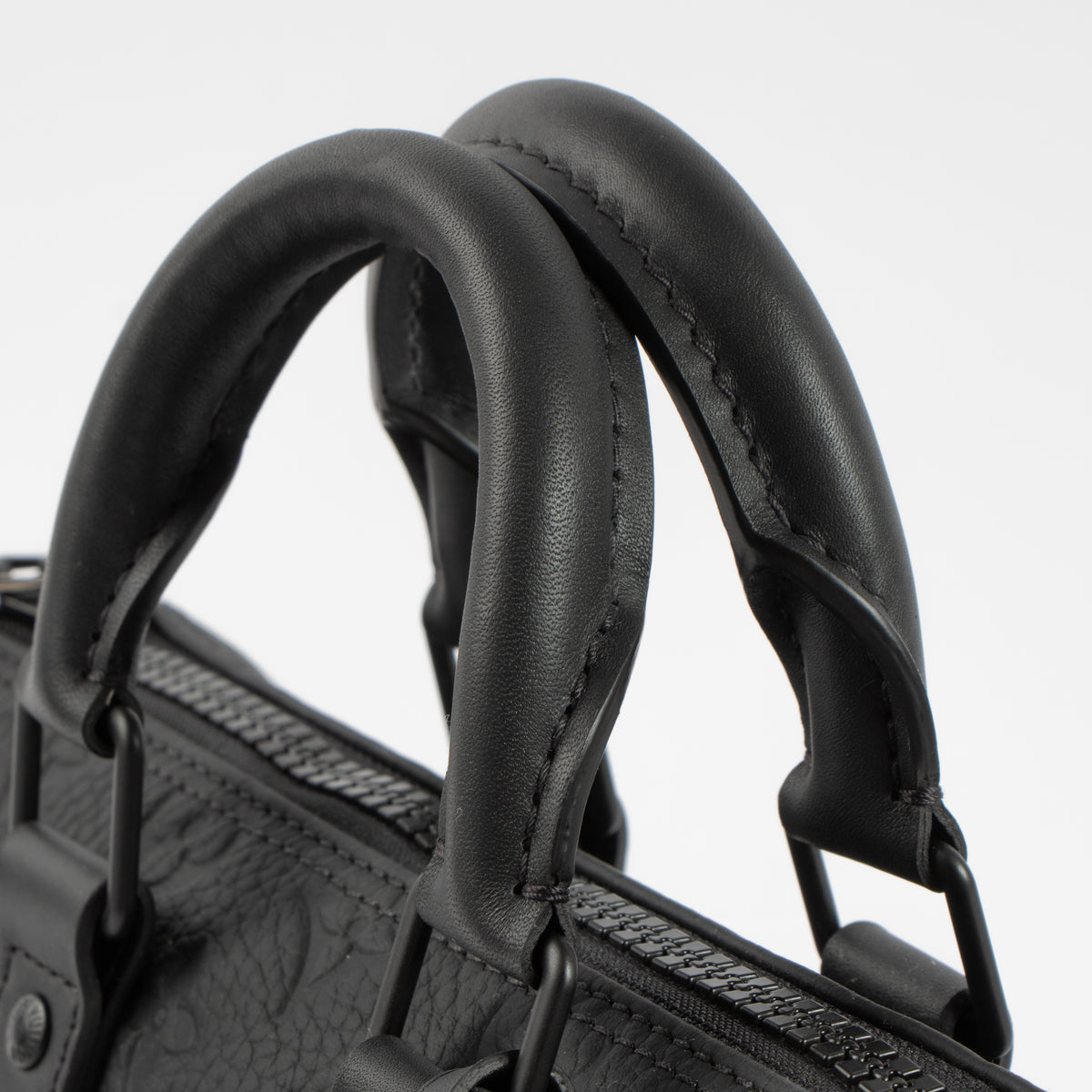 Shop this authentic Louis Vuitton Black Monogram Empreinte Keepall Bandouliere 20 pre-loved on Labellov.com