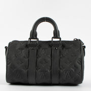Shop this authentic Louis Vuitton Black Monogram Empreinte Keepall Bandouliere 20 pre-loved on Labellov.com