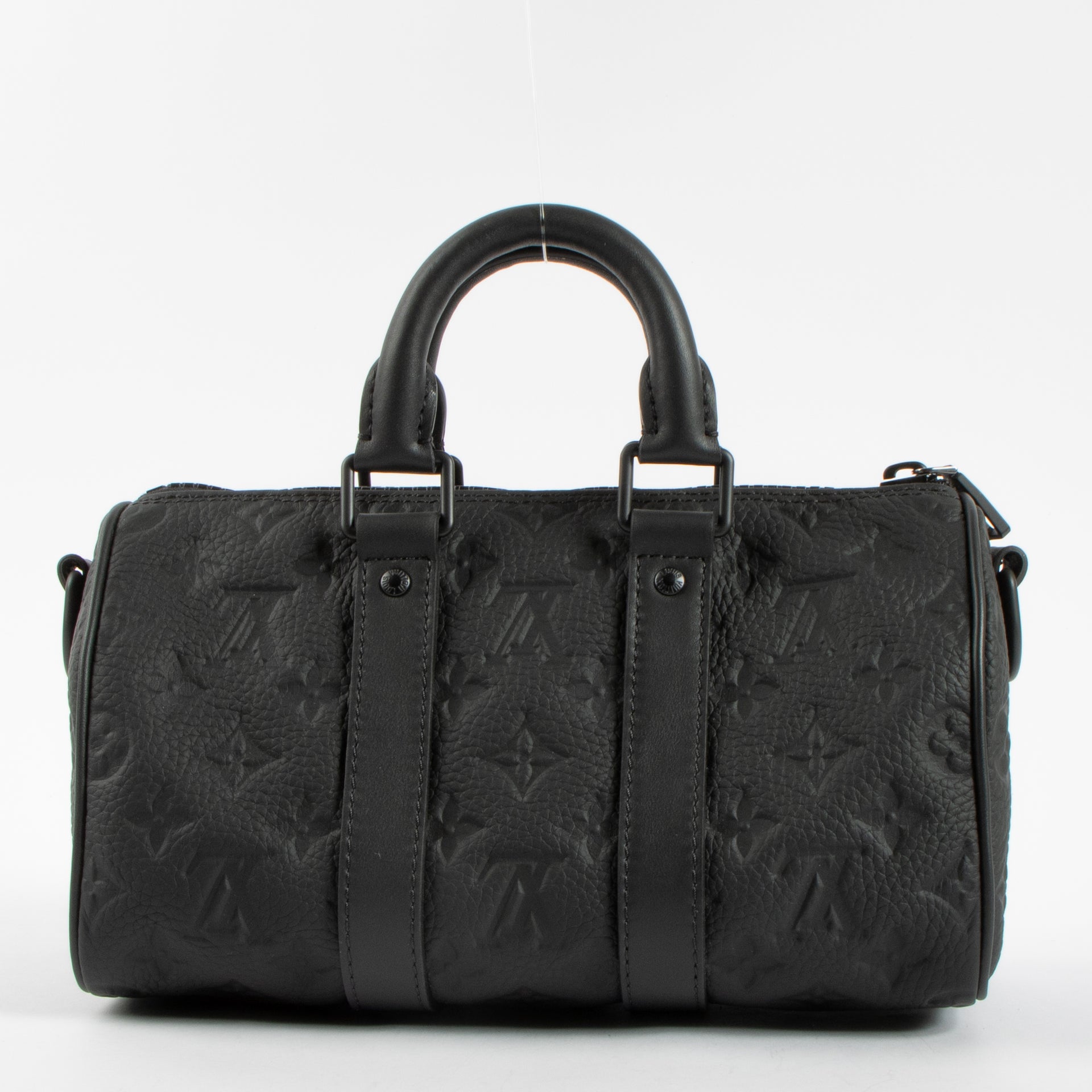 Shop this authentic Louis Vuitton Black Monogram Empreinte Keepall Bandouliere 20 pre-loved on Labellov.com