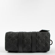 Shop this authentic Louis Vuitton Black Monogram Empreinte Keepall Bandouliere 20 pre-loved on Labellov.com