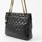 Shop the authentic Chanel Vintage Black Lambskin Ball Charm Tote Bag second hand on Labellov.com!