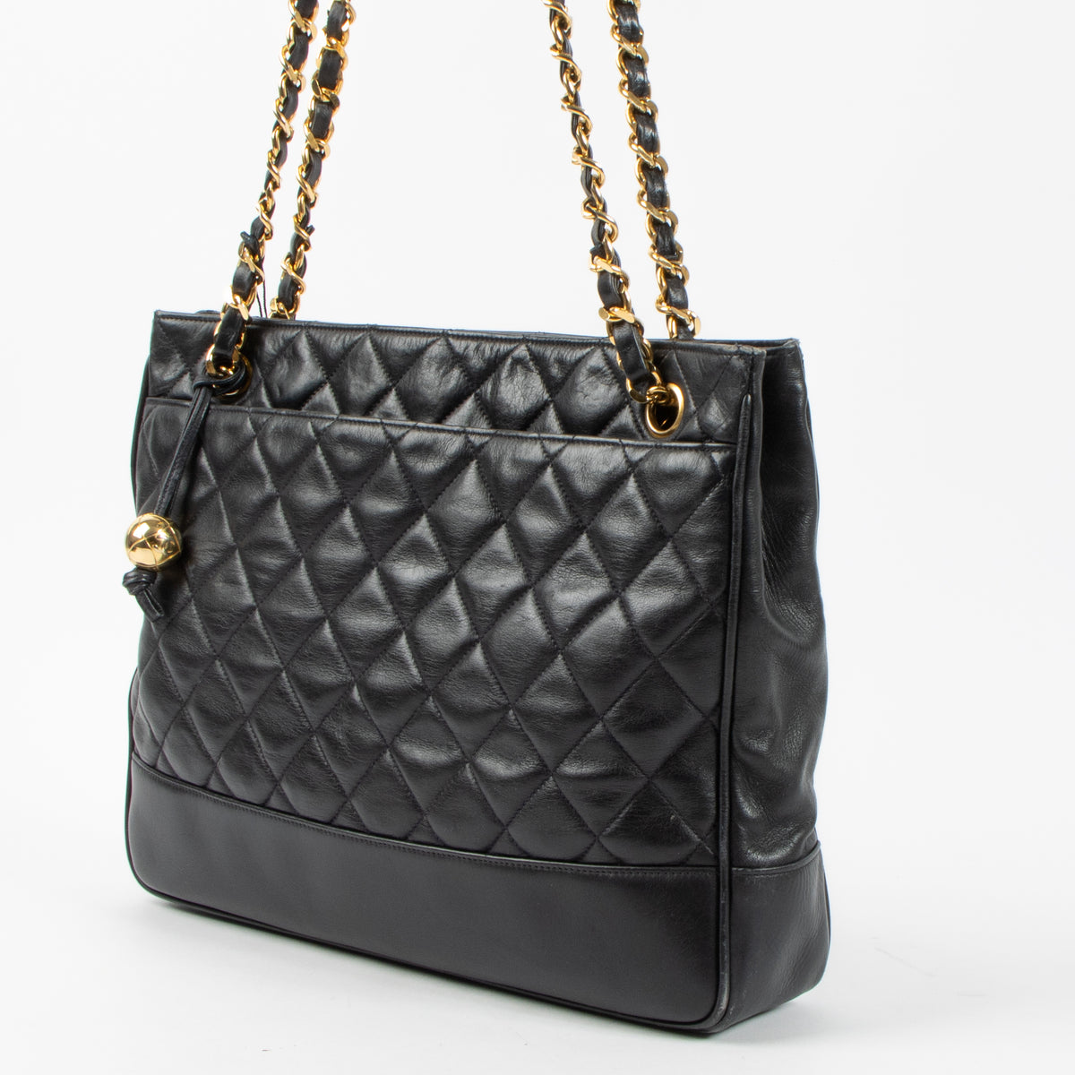 Shop the authentic Chanel Vintage Black Lambskin Ball Charm Tote Bag second hand on Labellov.com!
