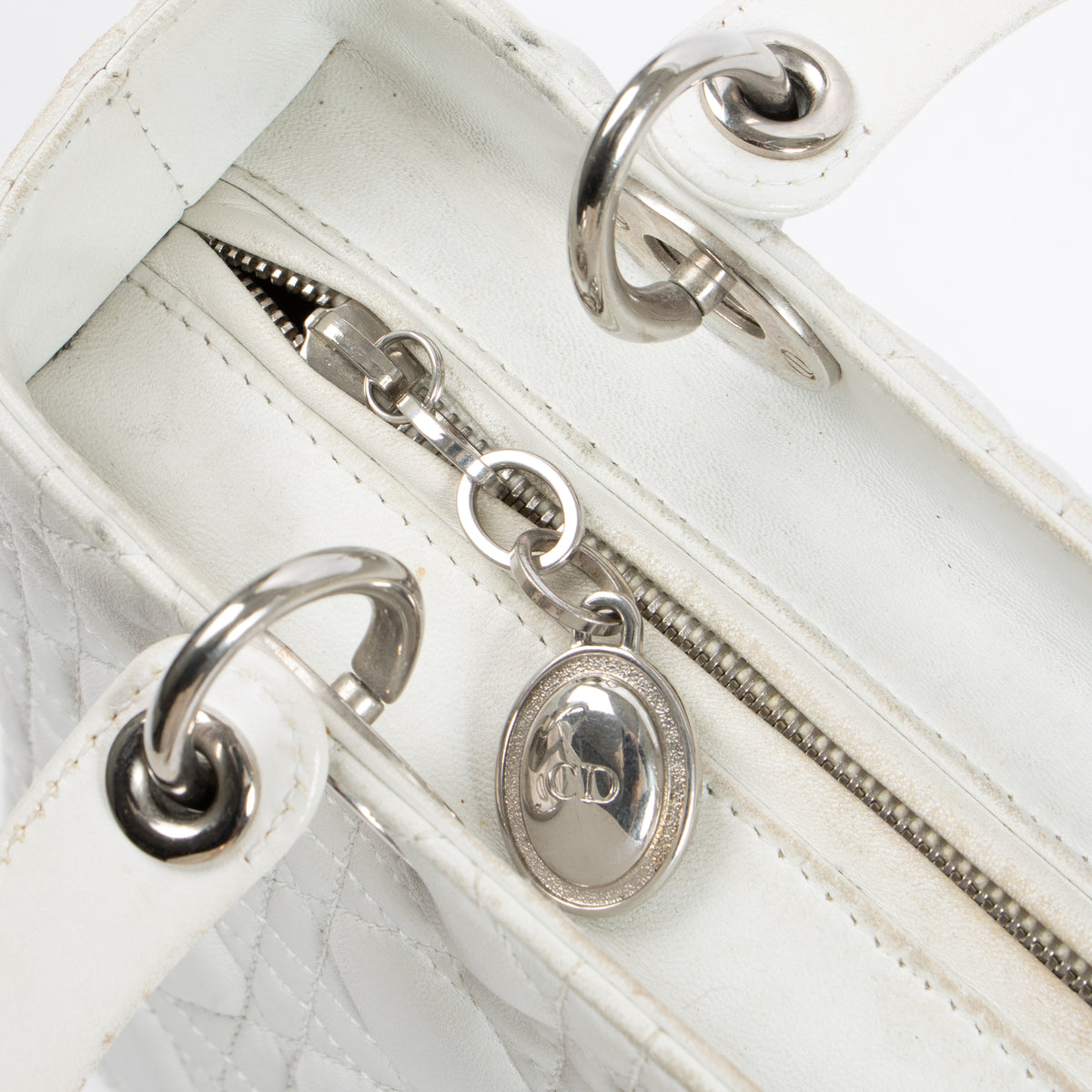 Shop this authentic Dior White Leather Medium Lady Dior Bag pre-loved on Labellov.com