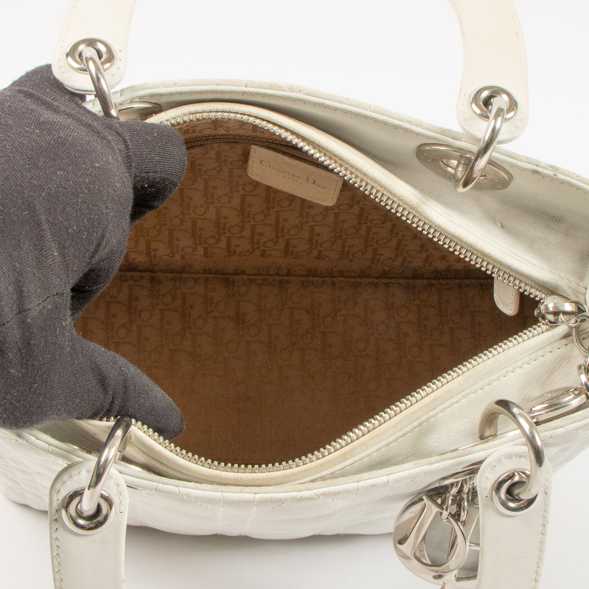 Shop this authentic Dior White Leather Medium Lady Dior Bag pre-loved on Labellov.com