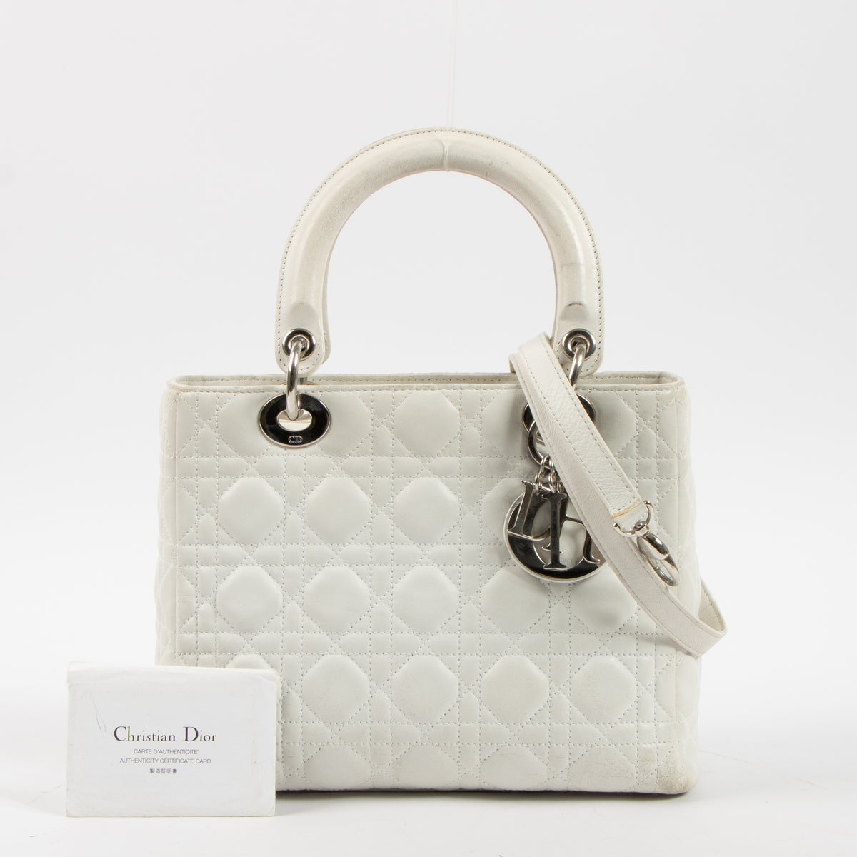 Shop this authentic Dior White Leather Medium Lady Dior Bag pre-loved on Labellov.com