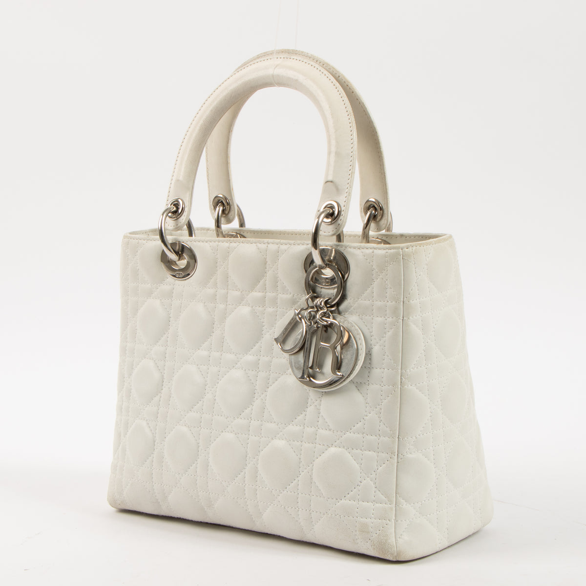 Shop this authentic Dior White Leather Medium Lady Dior Bag pre-loved on Labellov.com