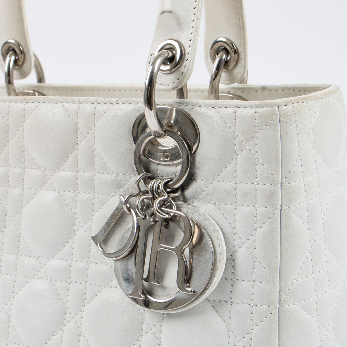 Shop this authentic Dior White Leather Medium Lady Dior Bag pre-loved on Labellov.com