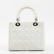 Shop this authentic Dior White Leather Medium Lady Dior Bag pre-loved on Labellov.com