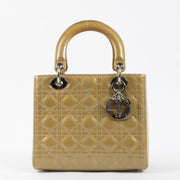 Shop this authentic Dior Beige Patent Leather Medium Lady Dior Bag pre-loved on Labellov.com