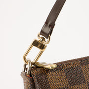 Shop this authentic luxury Louis Vuitton Damier Ebene Pochette pre-loved on Labellov.com