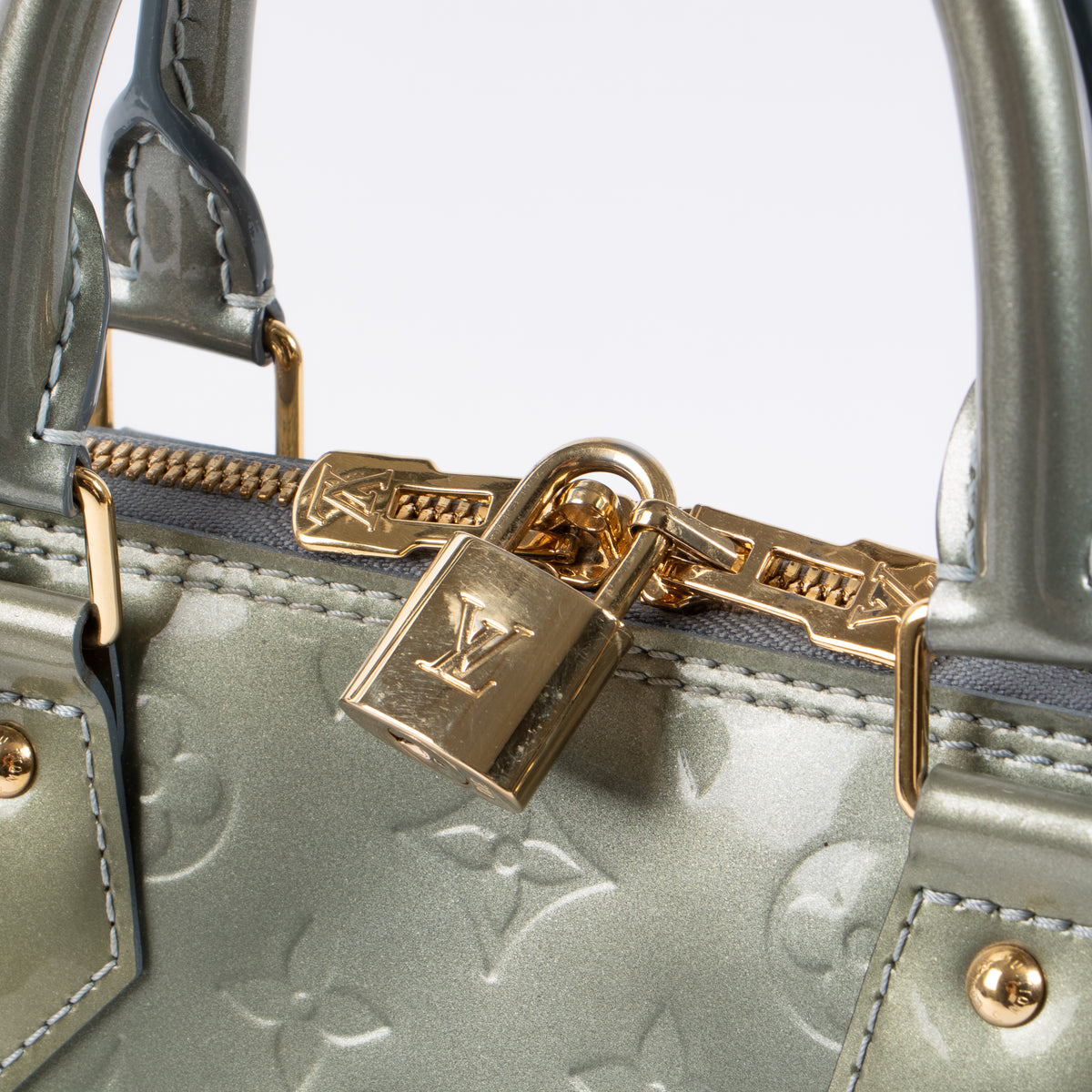 Shop this authentic luxury Louis Vuitton Gris Art Deco Monogram Vernis Alma PM Bag pre-loved on Labellov.com