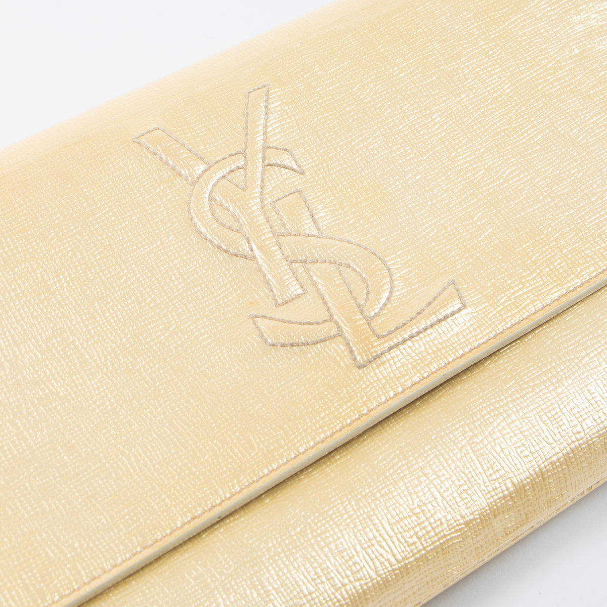 Shop this authentic luxury Saint Laurent Gold Patent Clutch at Labellov.com 