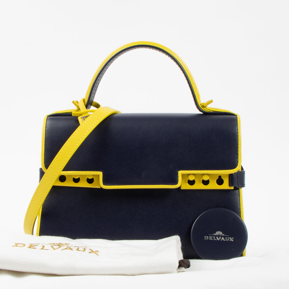 Shop the authentic Delvaux Indigo/Safran Calf Souple Tempete Mini Illusion Bag second hand on Labellov.com!