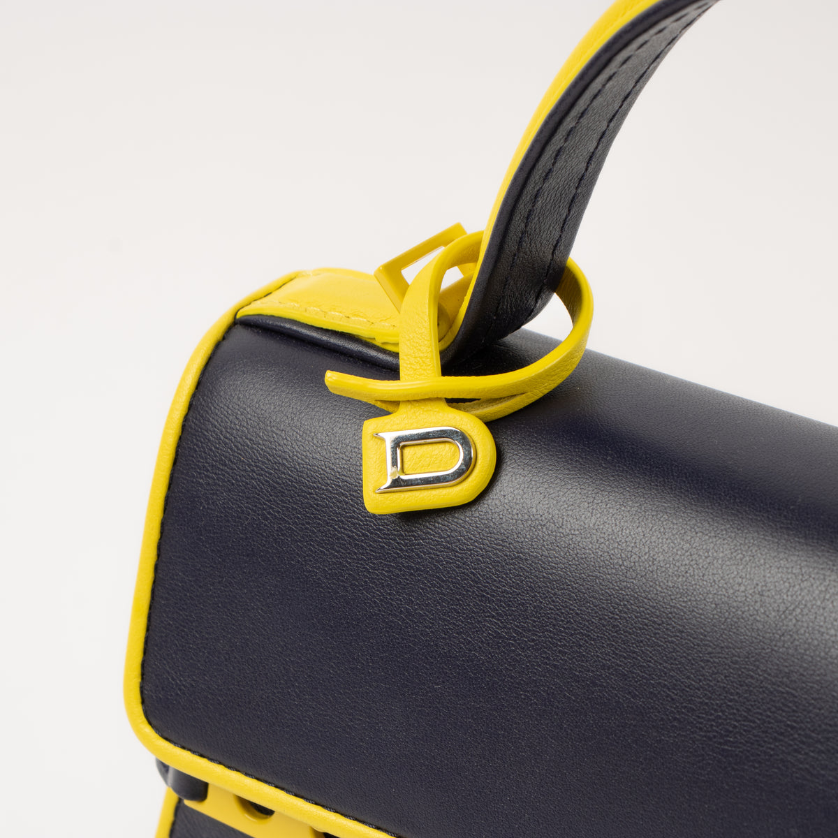 Shop the authentic Delvaux Indigo/Safran Calf Souple Tempete Mini Illusion Bag second hand on Labellov.com!