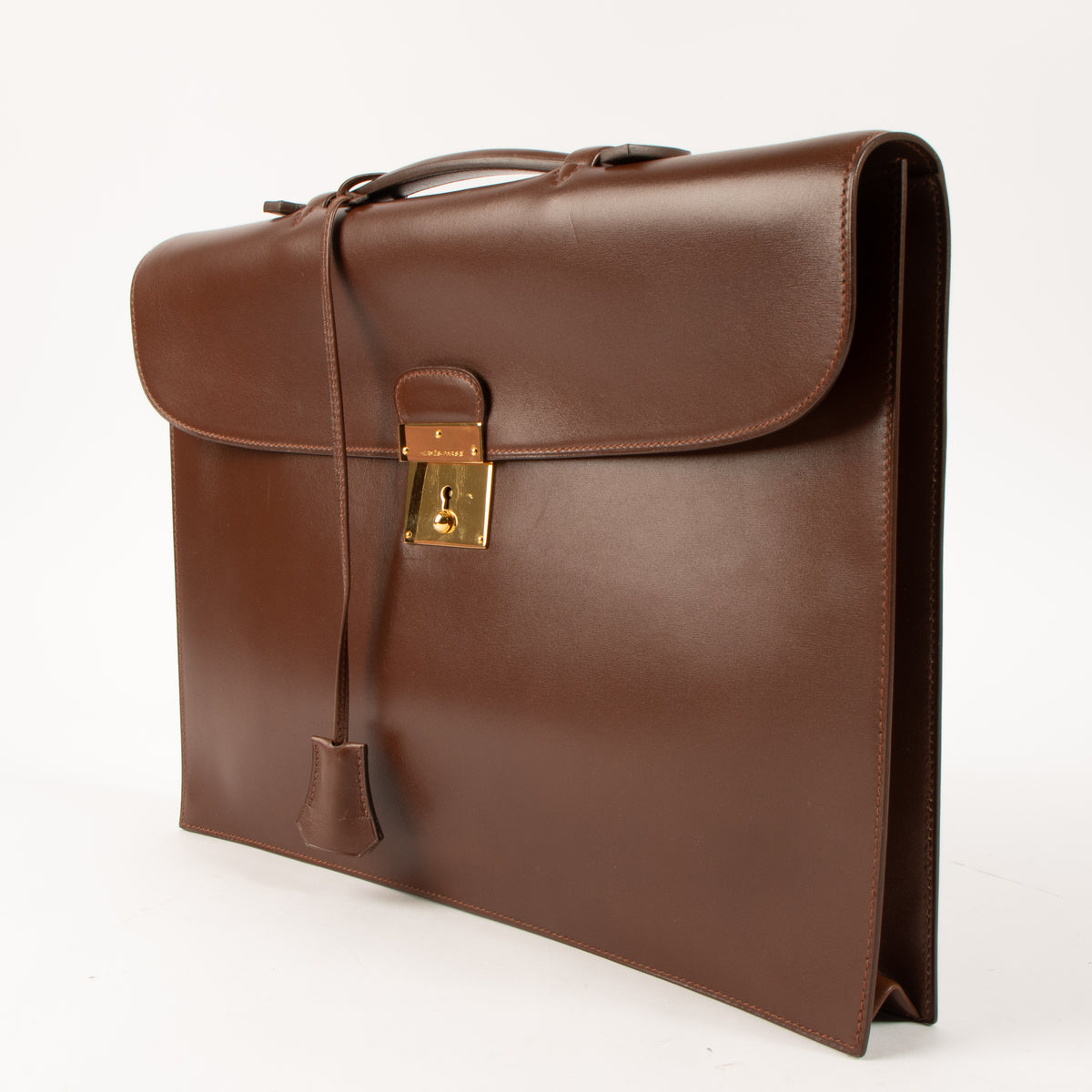Shop this authentic luxury Hermes Quirus Briefcase Brown Box GHW pre-loved on Labellov. 