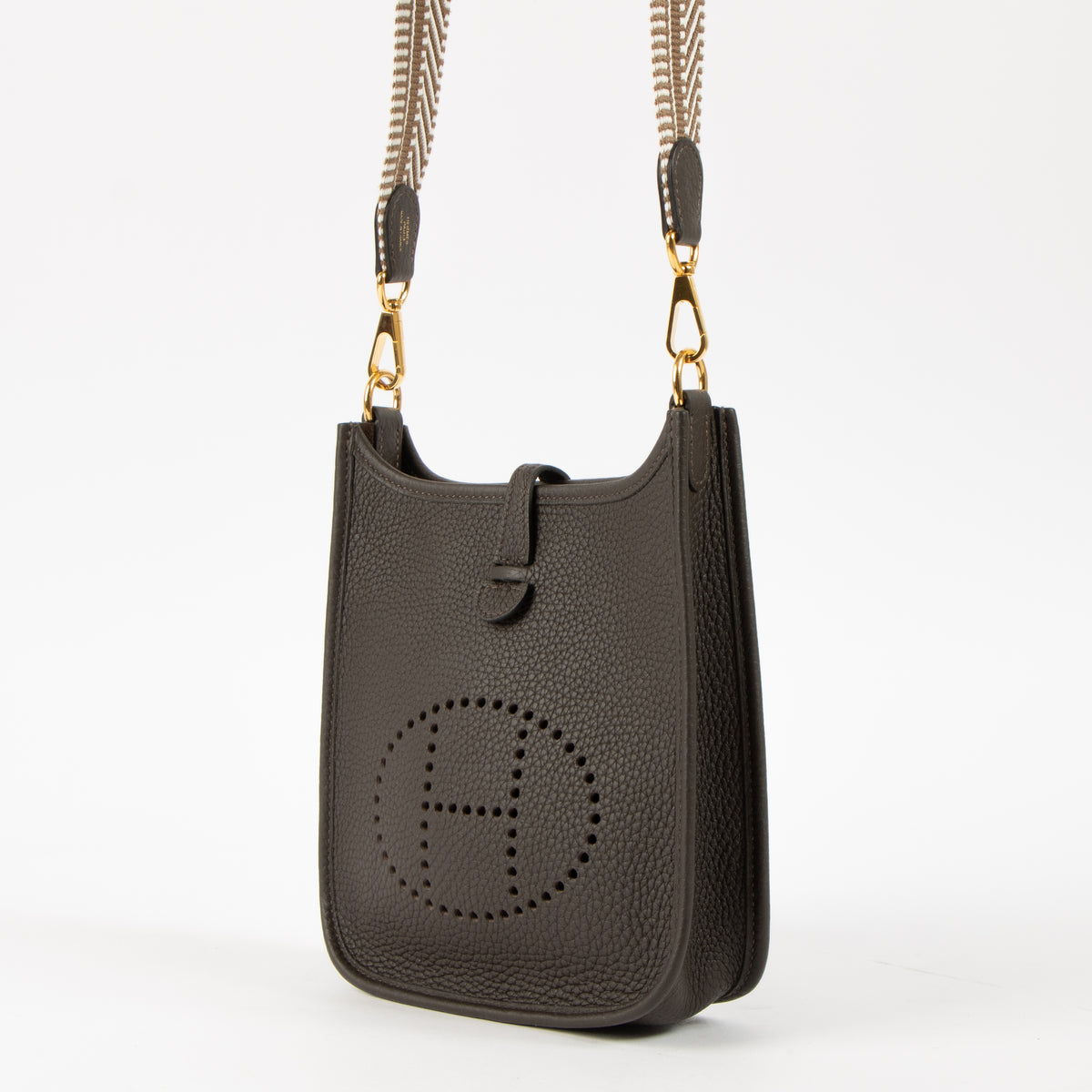 Shop this authentic Hermes Evelyne 16 Ebene Clemence Sangle Cavale GHW pre-loved on Labellov.com 