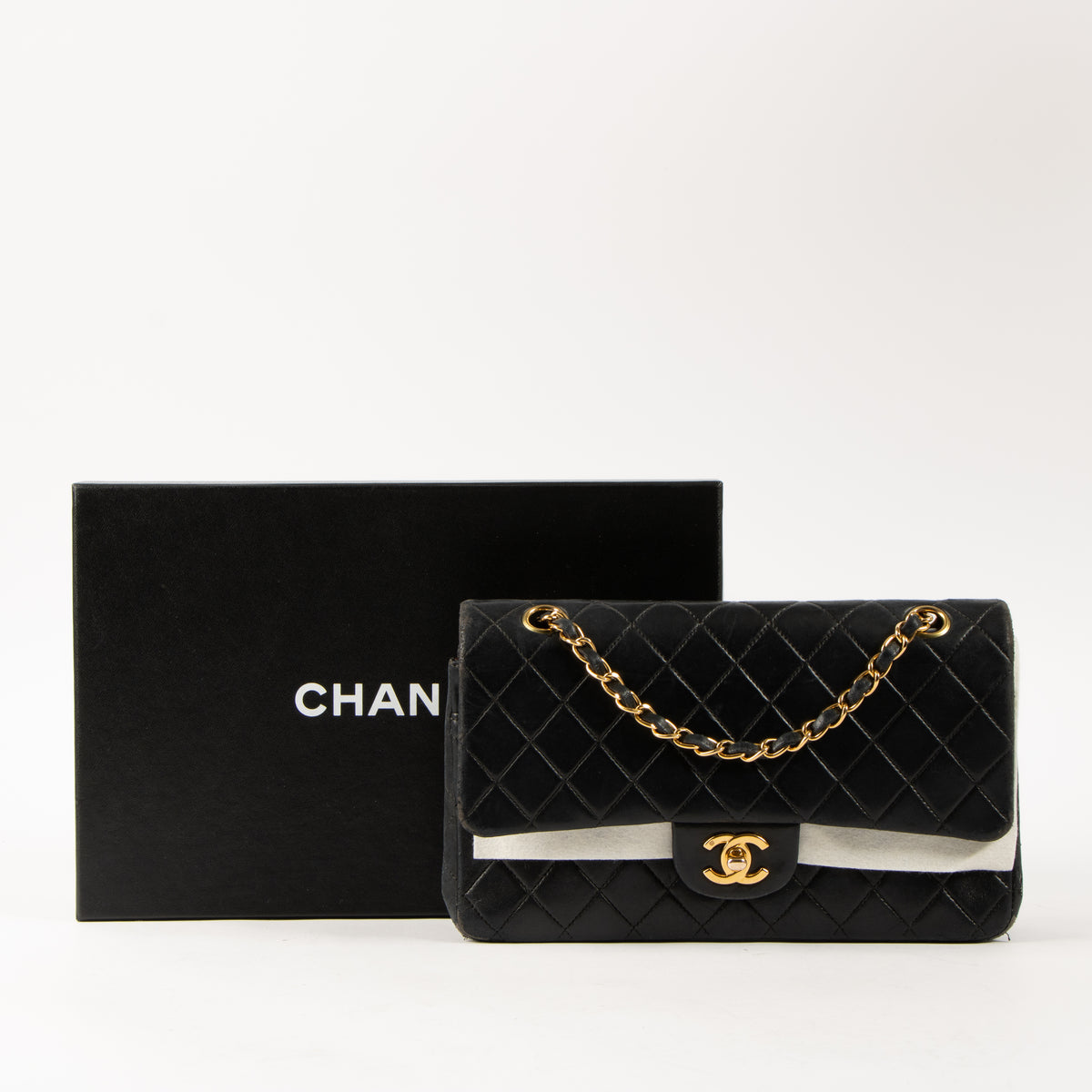 Shop this authentic Chanel Vintage Black Lambskin Medium Classic bag pre-loved on Labellov.com