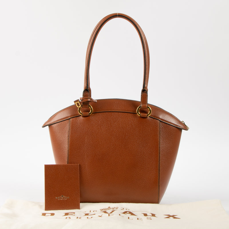 Shop this authentic Delvaux Cognac Jumping Charme Bag pre-loved on Labellov.com