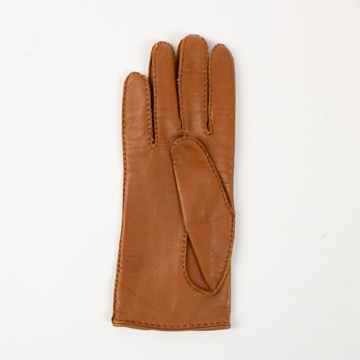 Shop the authentic Hermès Camel Lambskin Gloves - Size 7 on Labellov.com.