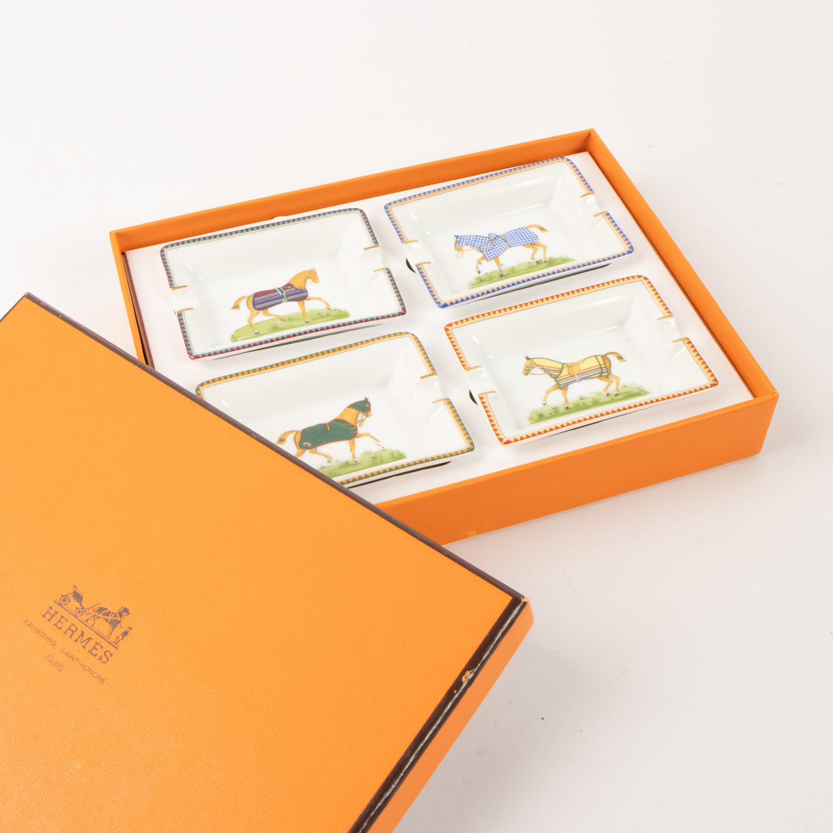 Shop the authentic Hermes Porcelain Chevaux Set of 4 Mini Ashtrays on Labellov.com.