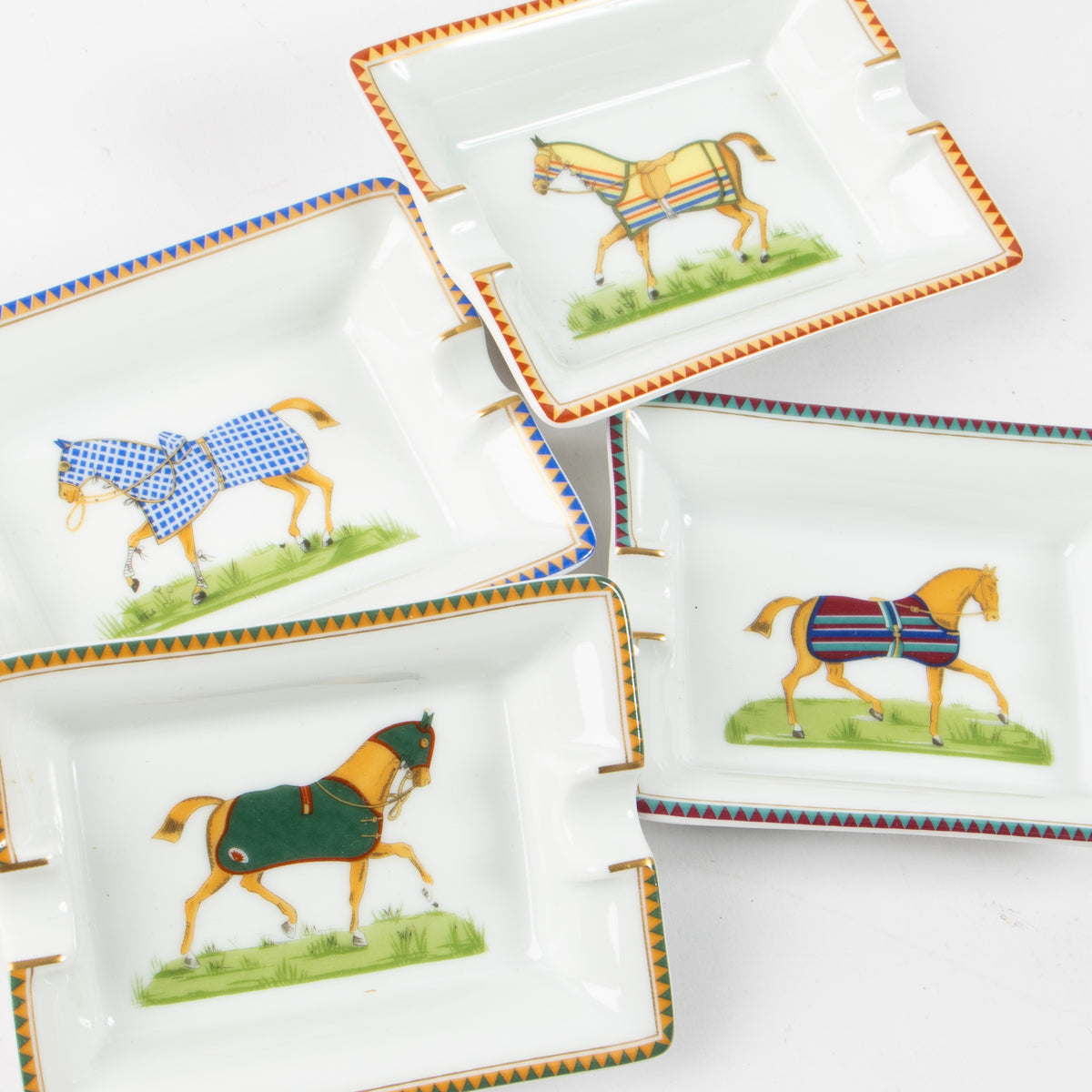 Shop the authentic Hermes Porcelain Chevaux Set of 4 Mini Ashtrays on Labellov.com.