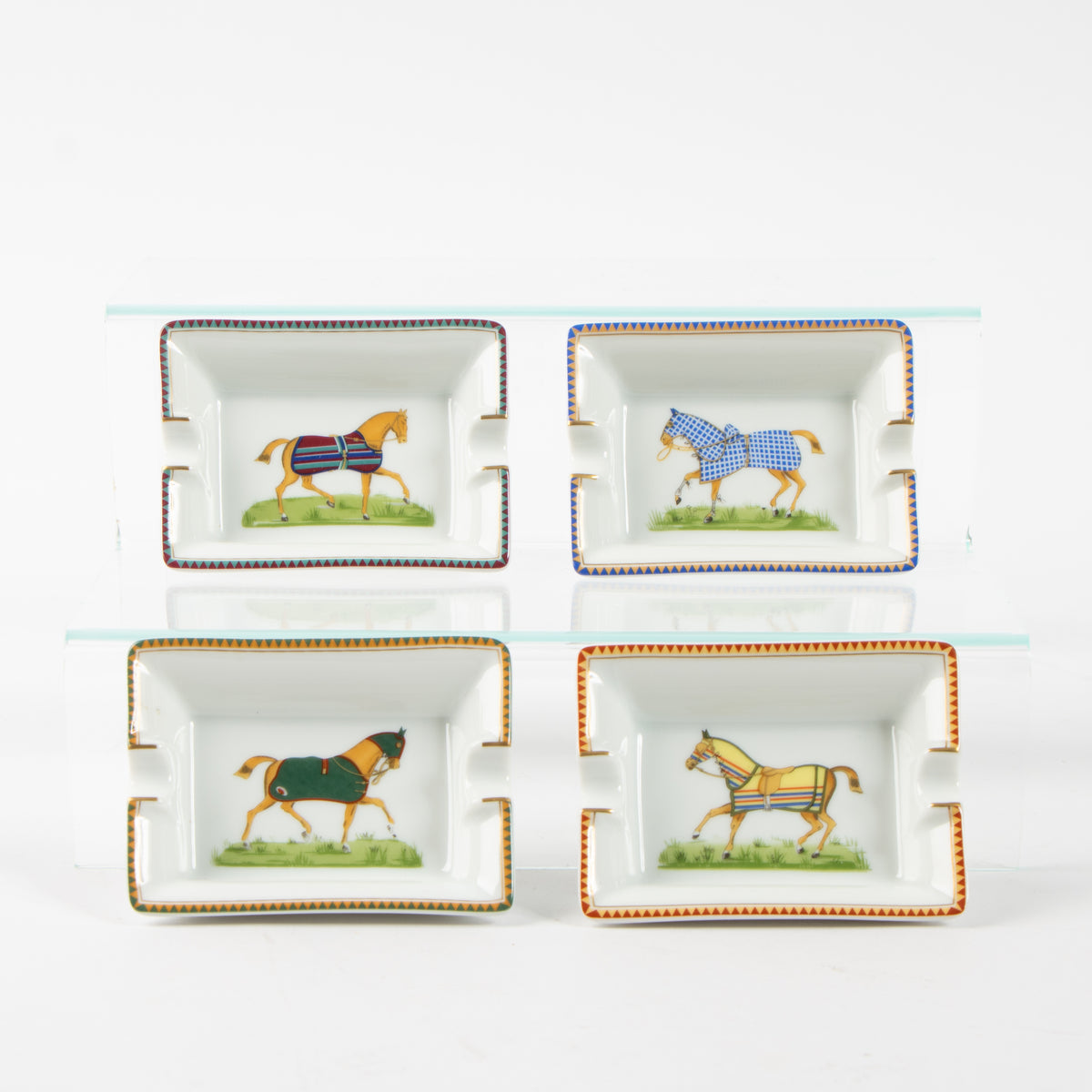 Shop the authentic Hermes Porcelain Chevaux Set of 4 Mini Ashtrays on Labellov.com.