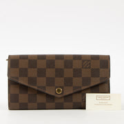 Shop this authentic Louis Vuitton Damier Ebene Sarah Wallet Pre-Loved on Labellov.com