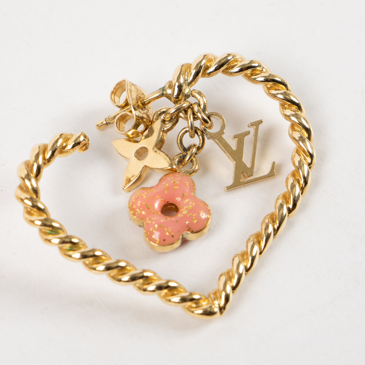 Shop this authentic Louis Vuitton Gold Tone Sweet Monogram Hoop Earrings Pre-Loved on Labellov.com
